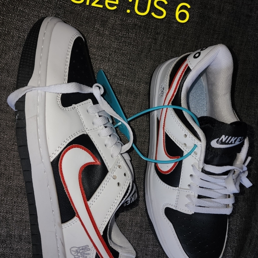 Nike Black and White Shoes with Red Highlights